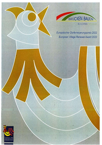 Deckblat, Zeitschrift Brücken Bauen, grosser Hahn aus geometrischen Formen in grau und gold-gelb, rechts oben Logo der Zeitschrift mit Titel